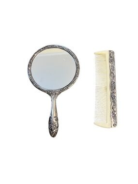 Vintage silver-plated vanity set of a handheld mirror and a matching comb